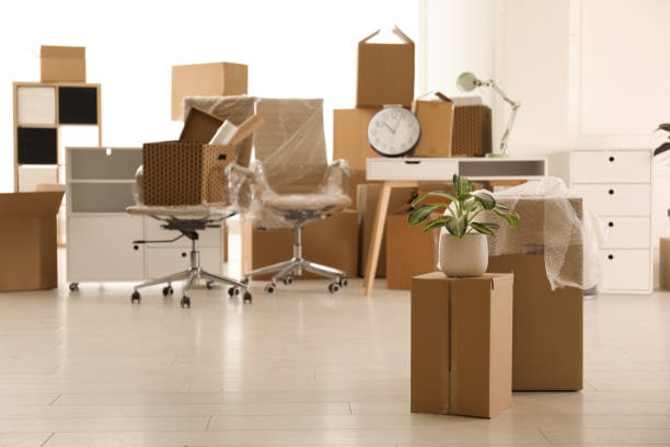 Forward Thinking Movers packing up a St. Petersburg office - desks cleared, chairs wrapped and boxes stacked to move