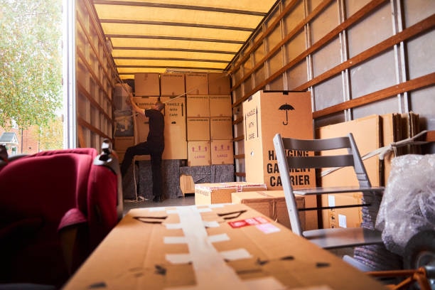 Forward Thinking Movers loading boxes and furniture into a moving truck for a local move